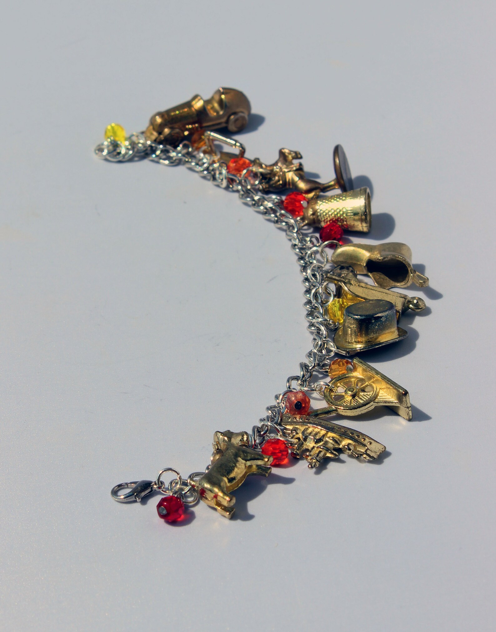 Gold Monopoly Token Charm Bracelet With Fiery Glass Beads Etsy