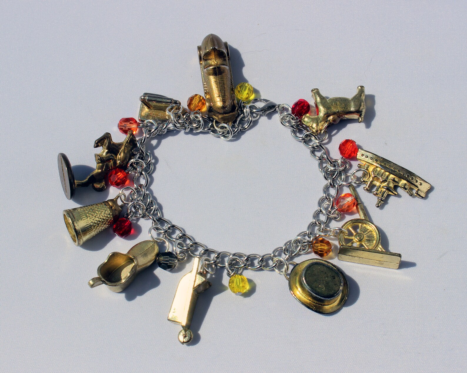 Gold Monopoly Token Charm Bracelet With Fiery Glass Beads Etsy