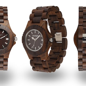 May include: A brown wooden wristwatch with a dark brown face and silver hands. The watch has a stainless steel clasp and the brand name "modply" is printed on the face and back of the watch.