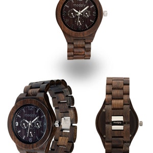 May include: Wooden wristwatch with a dark brown face and matching wooden band. The watch face features the brand name "modply" and three sub-dials. The watch is displayed from multiple angles, showcasing its design and craftsmanship.