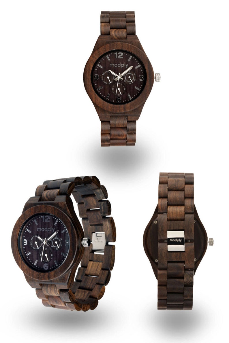 May include: Wooden wristwatch with a dark brown face and matching wooden band. The watch face features the brand name "modply" and three sub-dials. The watch is displayed from multiple angles, showcasing its design and craftsmanship.
