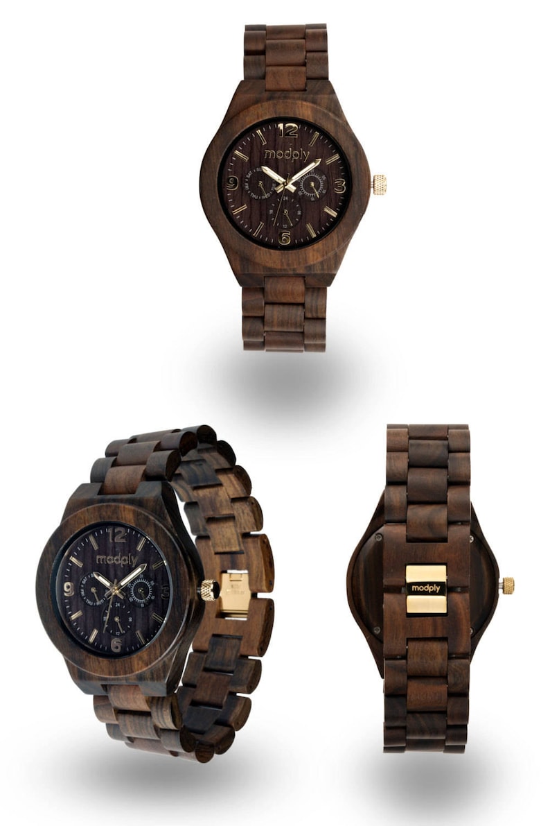 May include: A collection of wooden watches in various angles. The watches are made of dark brown wood with gold-colored accents. The watch face displays the brand name "modply". The watch bands are also made of wood.