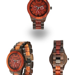 May include: Wooden watch with a reddish-brown face and a multi-toned wood band. The watch face features the brand name "modply" and three sub-dials. The watch case and band are made of a combination of dark and light wood tones.