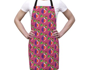 May include: A pink apron with a repeating pattern of purple figs with green leaves. The apron has adjustable straps and a pocket.
