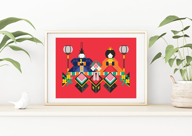 May include: A framed illustration of a traditional Japanese doll display, featuring two dolls in colorful kimonos, with lanterns and flowers. The dolls are on a red background.