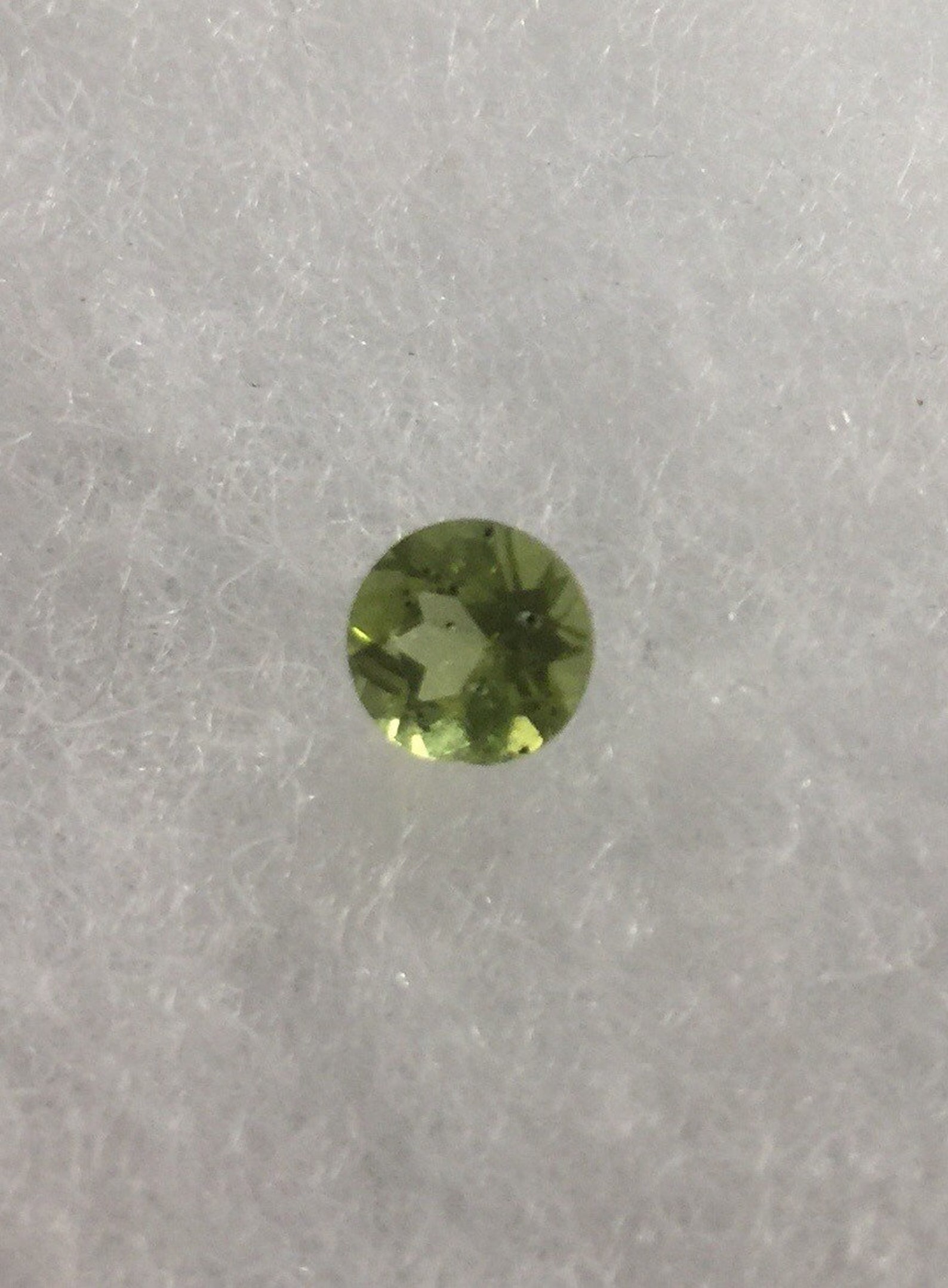 Peridot gemstones with inclusions. Etsy