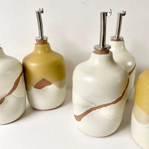 May include: A rustic wooden sign with the text "Welcome to our home" in white lettering. The sign features a distressed finish and a simple, inviting design, perfect for a front porch or entryway.