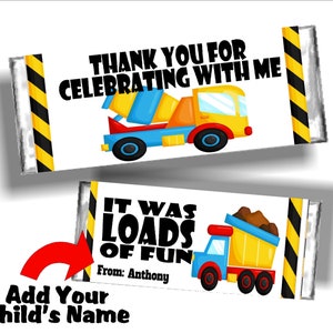 May include: Two candy bar wrappers with construction-themed graphics. One wrapper says "THANK YOU FOR CELEBRATING WITH ME" and features a cartoon cement mixer. The other says "IT WAS LOADS OF FUN" and has a dump truck.