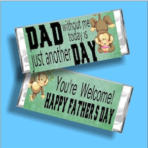 May include: Two candy bar wrappers with text and monkey illustrations. One wrapper reads "DAD just another DAY without me today is" and the other says "You're Welcome! HAPPY FATHER'S DAY". The background is green.