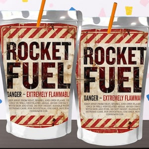 May include: Two clear pouches with the words "ROCKET FUEL" in large, bold letters. The pouches have a vintage, distressed design with red and white diagonal stripes and the warning "DANGER - EXTREMELY FLAMMABLE". Each pouch has an orange straw.
