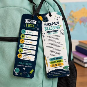 May include: Two rectangular bookmarks with black ribbons attached. The left bookmark is dark blue with the text 'TODAY I WILL' and a checklist of positive actions. The right bookmark is white with the text 'BACKPACK BLESSING' and inspirational messages for middle school students, featuring colorful illustrations of school supplies.