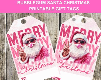 May include: Two printable gift tags with a Santa Claus graphic. Santa is wearing sunglasses and blowing a bubblegum bubble. The tags have the words "MERRY CHRISTMAS" in pink. The top of the tags have a hole for string.