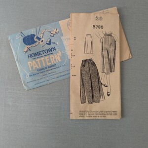 May include: Vintage sewing pattern from Hometown Pattern Fashion Bureau. The pattern packet features illustrations of skirts and the text "Hometown Pattern" in blue. The pattern number is 2780.