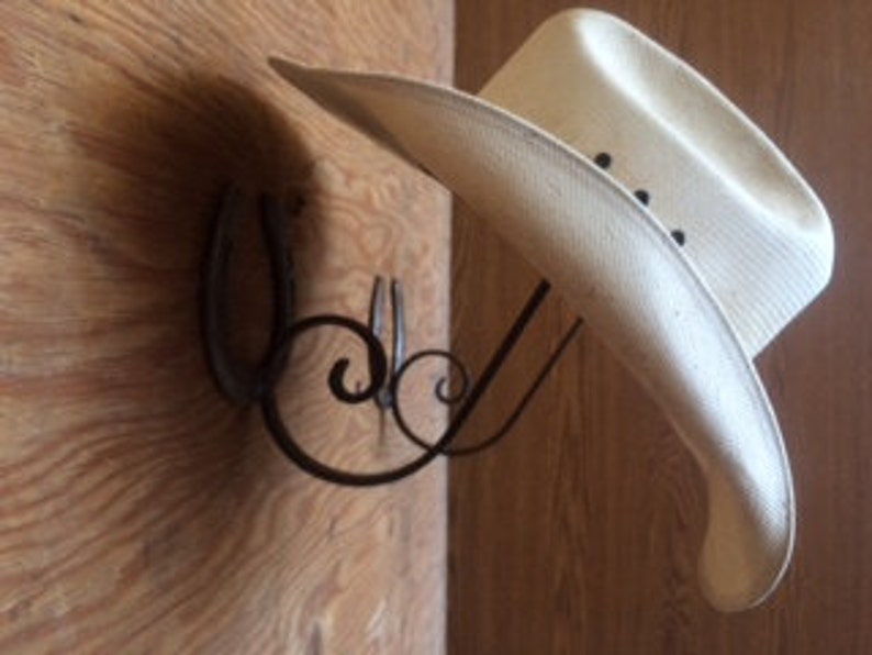 Rod iron horseshoe hat rack. Used repurpose horseshoes with | Etsy