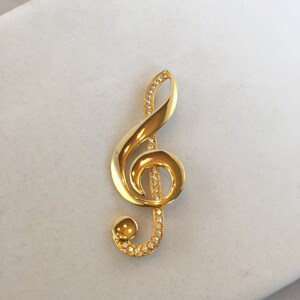Vintage JJ Treble Clef Brooch. Gold Tone and Rhinestones