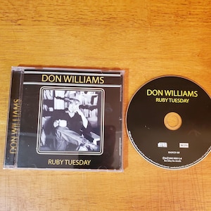 May include: A CD case and disc for Don Williams' album "Ruby Tuesday." The CD case is black with white text and a black and white photo of Don Williams. The CD is black with white text.