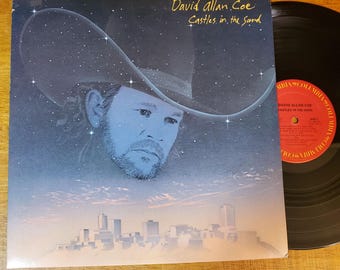 LP de vinilo de David Allan Coe - Castles In The Sand - Disco probado VG+ Música country clásica Outlaw - 1983 - The Ride