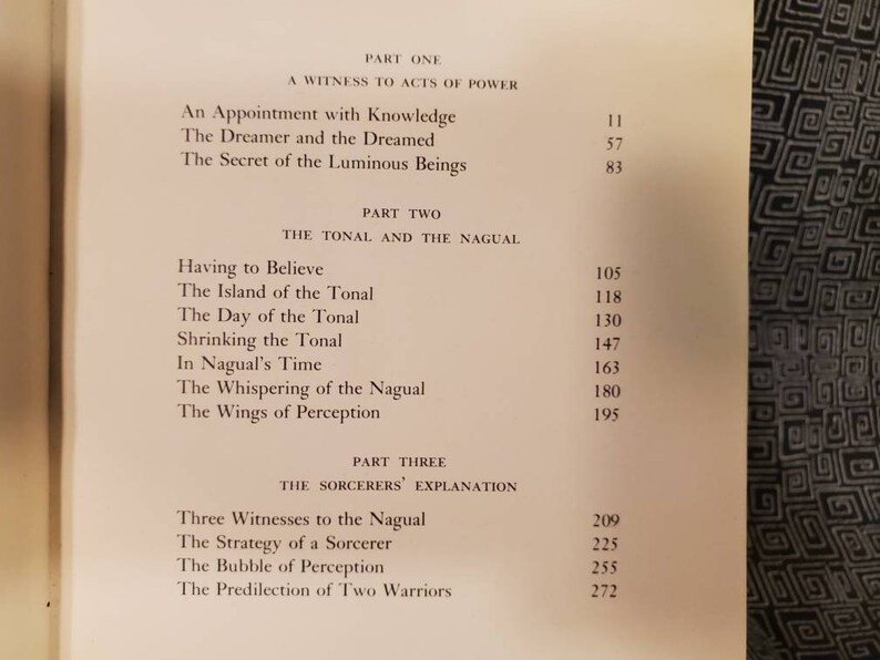 May include: A book titled "The Teachings of Don Juan: A Yaqui Way of Knowledge" by Carlos Castaneda. The book cover is white with black text. The table of contents lists the book's chapters and their corresponding page numbers.