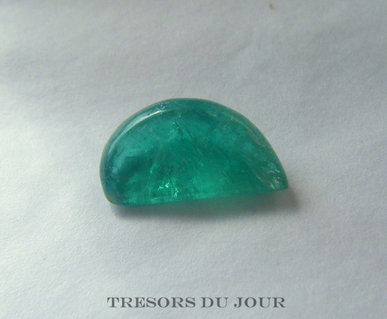 The bright green color is typical of natural Columbian emeralds, which also includes the natural interior inclusions that one would expect.
