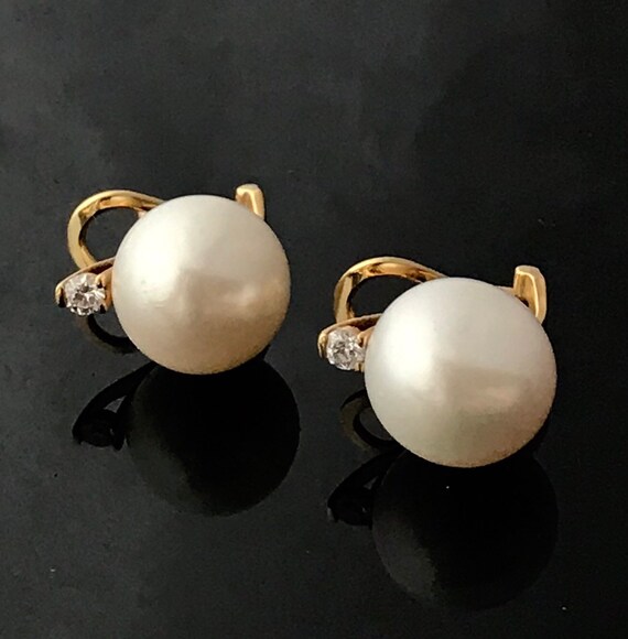 Omega back shop diamond earrings