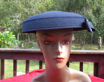 Vintage 1960's: 3 Tier Navy Linen Broadcloth Circular Hat W/ Top Stitched Rim Supported By Boning. Highlighted W/ Triangular Brooch And Bow
