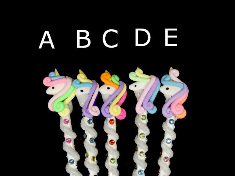 May include: Five colorful unicorn-shaped pencil toppers with white spiral pencils. The unicorn toppers are made of pastel pink, blue, yellow, and green.