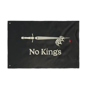 May include: Black flag with a white sword piercing a crown, a red drop of blood, and the words "No Kings" in white. The flag has grommets in the corners for hanging.
