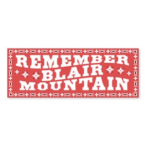 May include: A red banner with a white border and white text that reads "Remember Blair Mountain".
