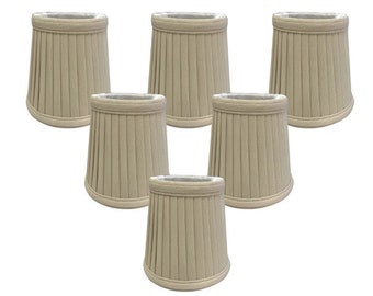 May include: Six beige fabric lampshades with a pleated design. The lampshades are cone-shaped with a white interior and a decorative trim at the top and bottom. The lampshades are arranged in a triangular pattern against a white background.