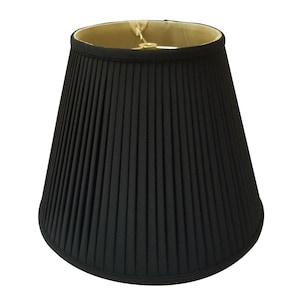 May include: A black pleated lampshade with a gold top.