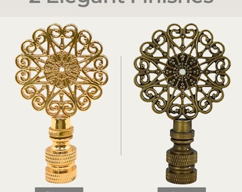May include: Two decorative finials with a detailed, ornate design. The finials are available in polished brass and antique brass finishes.  2 Elegant Finishes.