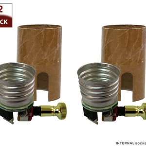 May include: Two pack of internal light bulb sockets with a cardboard sleeve. The sockets are made of metal and have a brass screw-on connector.