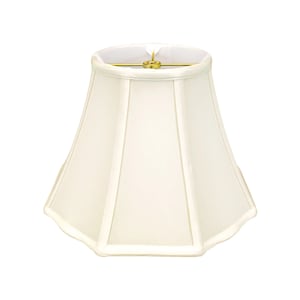 May include: A white, octagonal lampshade with a bell shape and a gold metal harp.