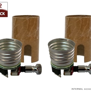 May include: Two pack of light bulb sockets with a brown cardboard sleeve and a silver metal socket. The sockets have a screw-on design and a small switch on the side. INTERNAL SOCKET ONLY.