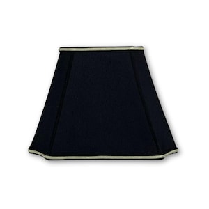 May include: A black lampshade with a white trim. The lampshade is square shaped and has a flat top.