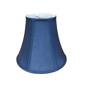 May include: A navy blue lampshade with a bell shape. The lampshade has a smooth, slightly textured surface and a white interior. The shade is designed to fit over a lamp base and diffuse light.