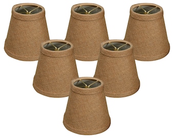 May include: Set of six brown burlap lampshades. Each shade is a simple, cone-shaped design with a gold metal frame.