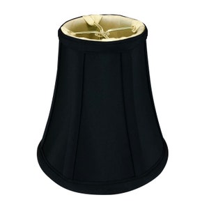 May include: A black fabric lampshade with a bell shape and a pleated design.