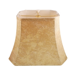 May include: A square-shaped lampshade with a beige, textured fabric exterior. The lampshade has a gold-colored metal frame.