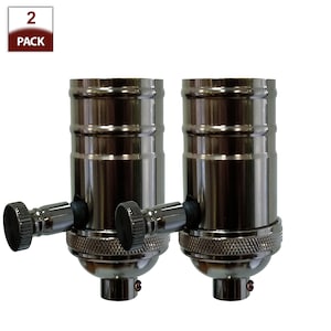 May include: Two black metal light bulb sockets with side switches.  2 Pack.