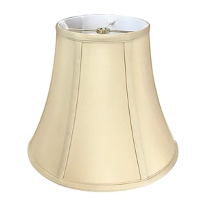 May include: A beige lampshade with a bell shape and a white lining. The lampshade has a simple design with a smooth fabric finish.