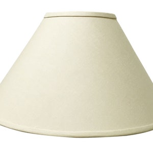 May include: A white fabric lampshade with a cone shape.