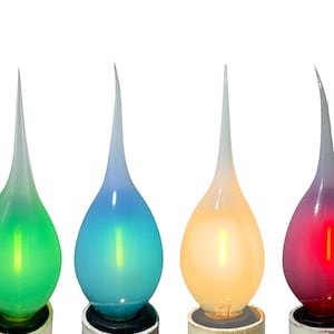 May include: Set of six flame-shaped LED light bulbs with a frosted glass finish. The bulbs are in various colors, including orange, green, blue, yellow, red, and white.