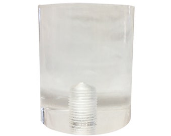 May include: A clear, rectangular furniture leg with a threaded metal insert. The leg is made of transparent acrylic and has a rounded top. The metal insert is silver and cylindrical.