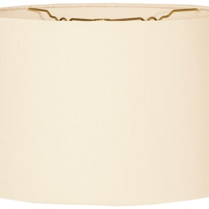 May include: A plain white drum lampshade with a gold metal harp.