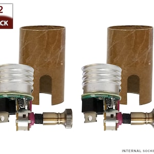 May include: Two pack of internal light bulb sockets with a brown cardboard shell and a silver metal base. The sockets have a built-in dimmer switch and a brass connector.  INTERNAL SOCKET ONLY.