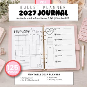 May include: A printable 2027 bullet planner journal in a pink binder. The open pages show a February calendar, a weekly to-do list, and heart-themed graphics. Text includes Bullet Planner 2027 Journal, 125 Pages, and Available in A4, A5 and Letter 8.5x11.
