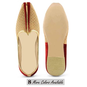 May include: Pair of tan and red slip-on shoes with a textured pattern. The shoes have a gold trim and a heart-shaped design on the front. The soles are a light tan color. The text "8 More Colors Available" is at the bottom.