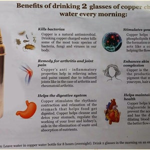 May include: A copper water bottle with a shiny finish. The image includes text detailing the benefits of drinking copper-charged water, such as killing bacteria and improving skin health. The bottle is cylindrical with a rounded top.