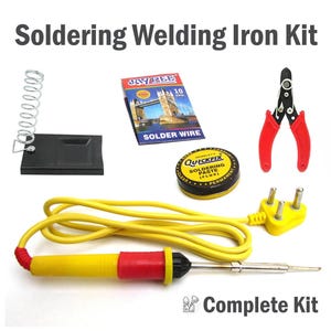 May include: A soldering welding iron kit featuring a yellow and red soldering iron with a yellow cord, a black metal stand, a coil of Jay Pee solder wire, a tin of Quickfix soldering paste, and red-handled wire stripping pliers.